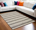 9' X 13' Brown Gray And Ivory Wool Striped Hand Woven Area Rug