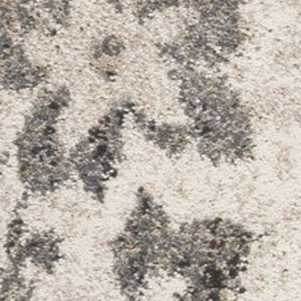 5' X 8' Gray And Tan Floral Distressed Area Rug