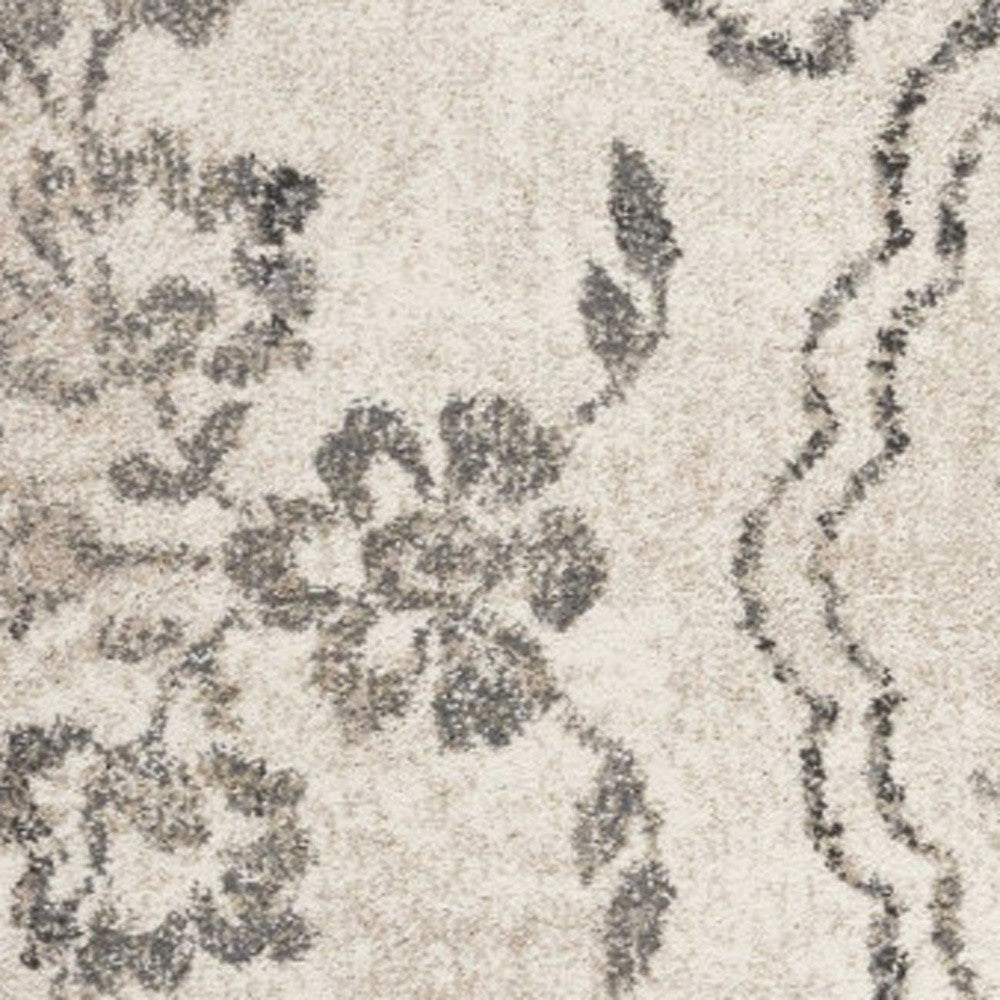 5' X 8' Gray And Tan Floral Distressed Area Rug