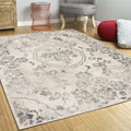 5' X 8' Gray And Tan Floral Distressed Area Rug