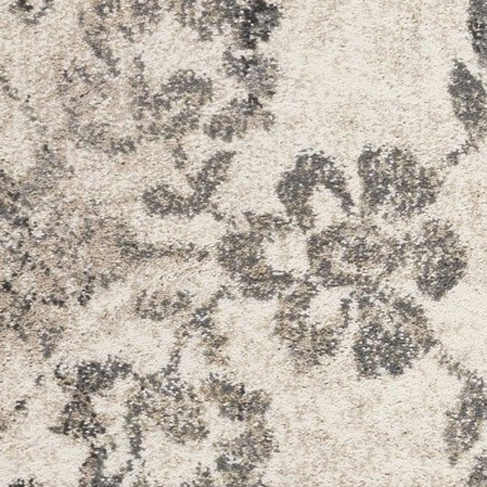 5' X 8' Gray And Tan Floral Distressed Area Rug