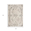 5' X 8' Gray And Tan Floral Distressed Area Rug