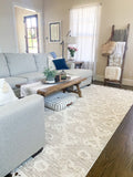 5' X 8' Beige and Ivory Geometric Area Rug