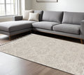 5' X 8' Beige and Ivory Geometric Area Rug