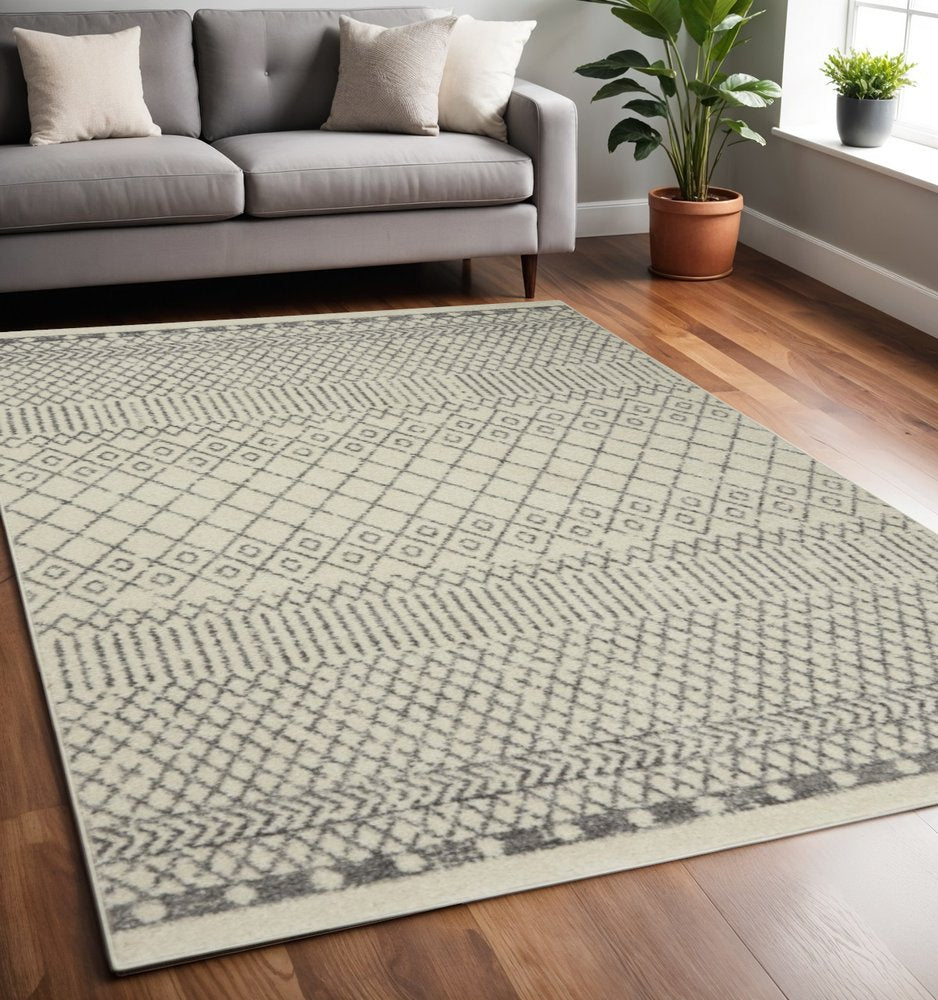 5' X 7' Gray And Ivory Geometric Distressed Area Rug