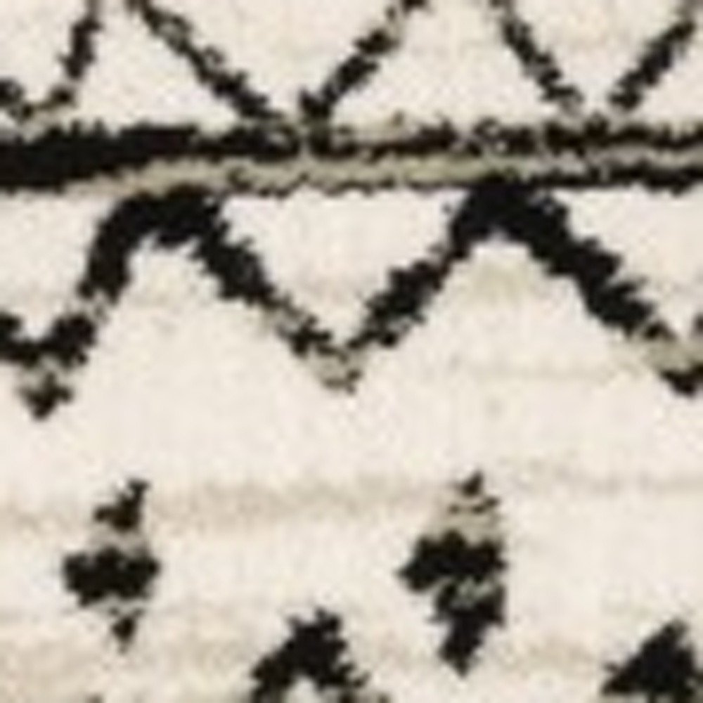 5' X 7' Ivory And Black Abstract Geometric Distressed Area Rug