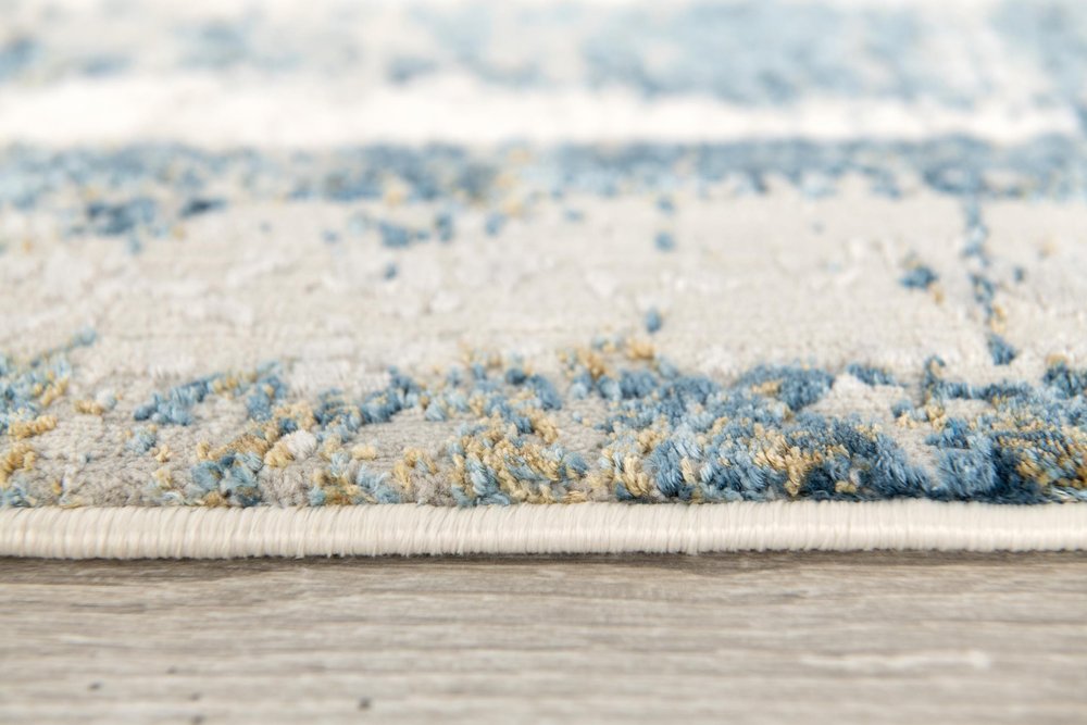 5' X 7' Blue and Ivory Abstract Area Rug
