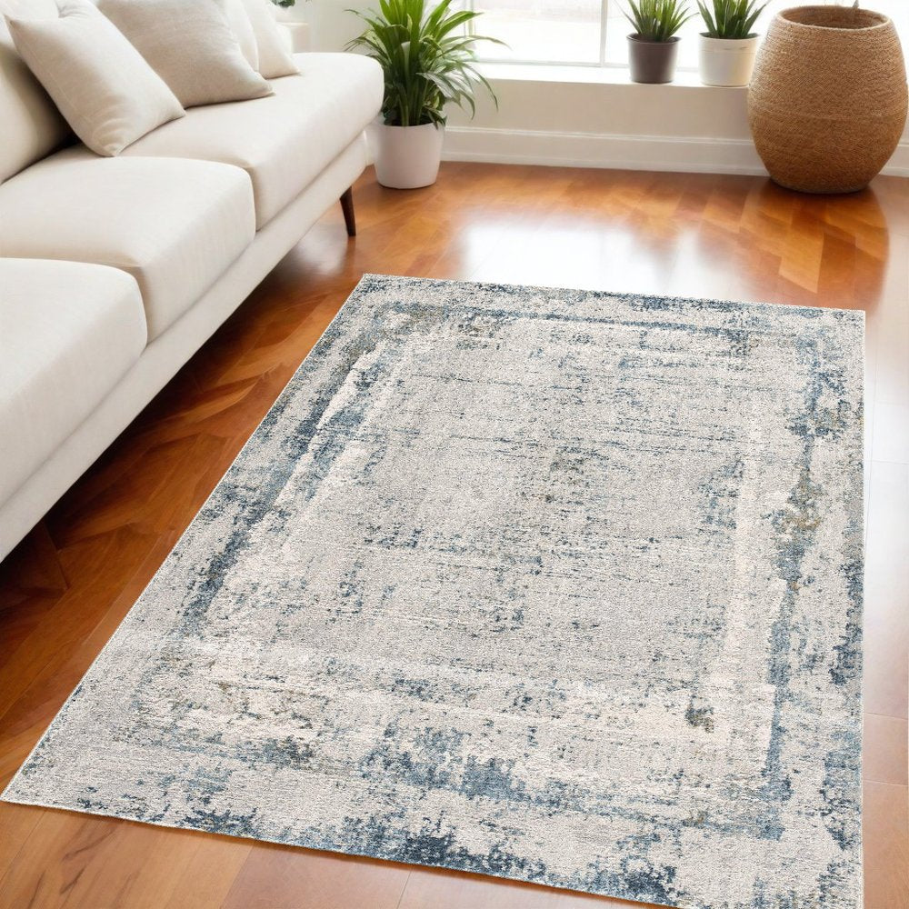 5' X 7' Blue and Ivory Abstract Area Rug