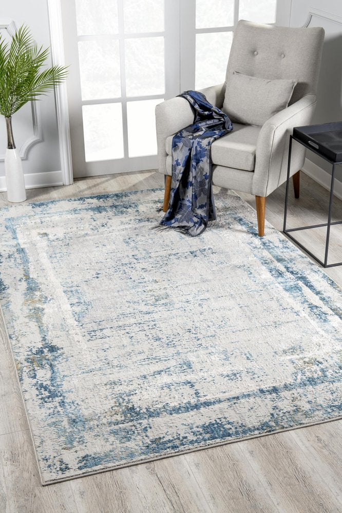 5' X 7' Blue and Ivory Abstract Area Rug