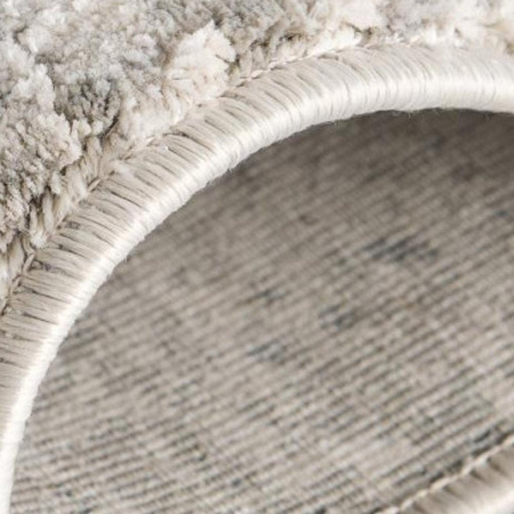 5' X 7' Gray and Ivory Abstract Area Rug