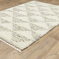 8' X 11' Ivory And Green Geometric Shag Area Rug With Fringe