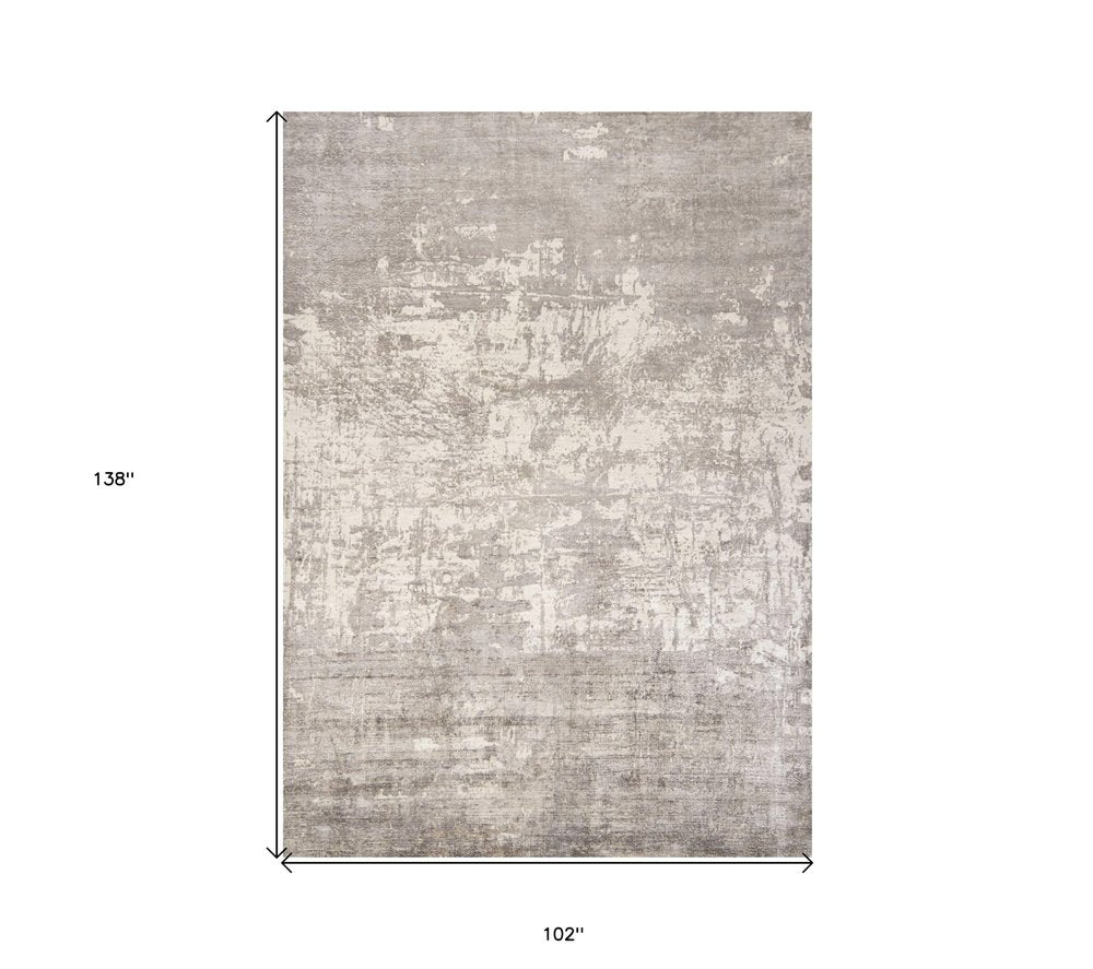 8' X 11' Beige And Ivory Abstract Hand Loomed Area Rug