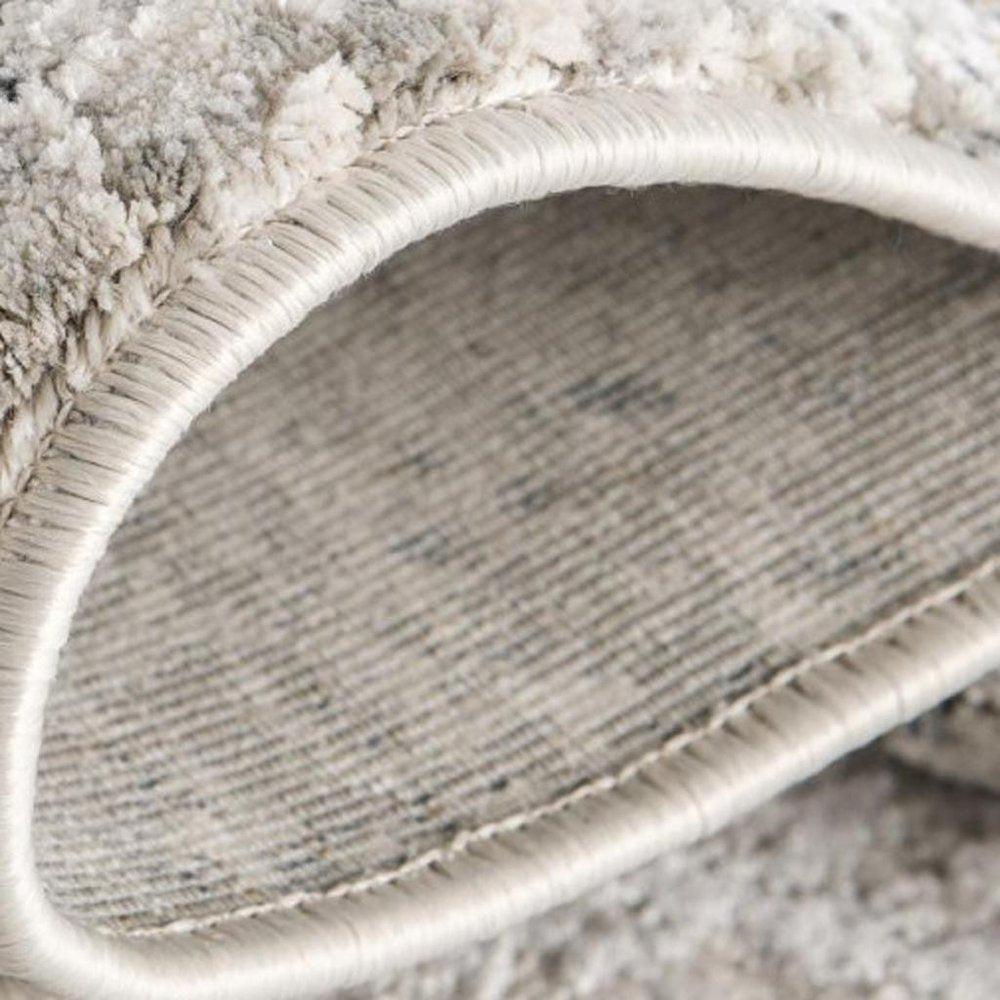 5' X 7' Gray and Ivory Abstract Area Rug