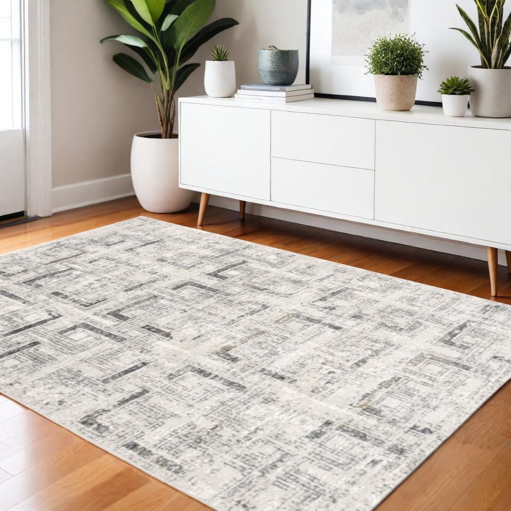 5' X 8' Gray and Ivory Abstract Power Loom Area Rug