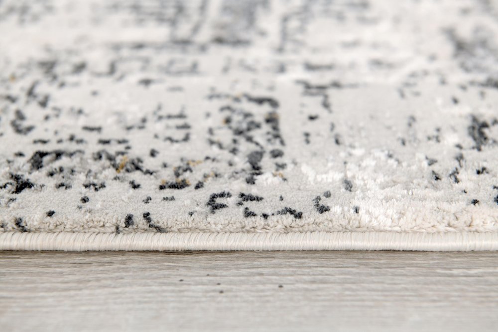 5' X 8' Gray and Ivory Abstract Power Loom Area Rug