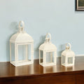 Set of Three Ivory Distressed Glass And Metal Floor Lantern Candle Holders